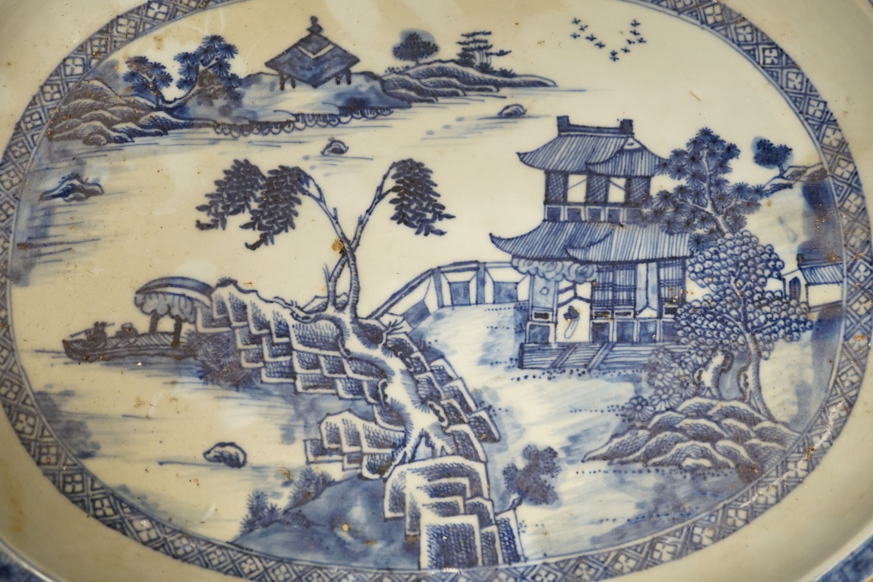 An 18th century Chinese export oval blue and white dish, 32cm.